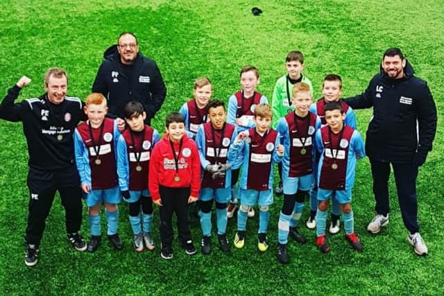 Hillmorton Under 11s celebrating with their medals last Saturday